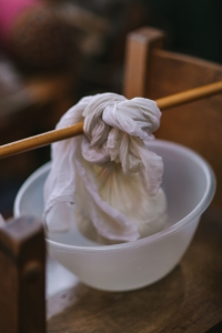 Straining yoghurt to make labneh