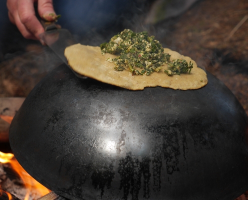 Cooking gözleme on a wok