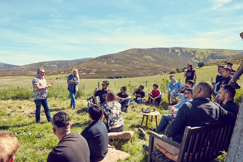 Ghillie talking to a group of whisky ambassadors in her garden