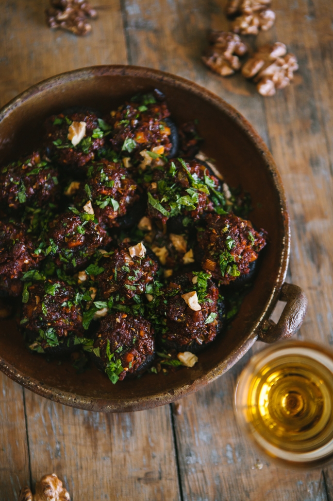 A dish of spiced stuffed mushrooms, with a dram of whisky by the side