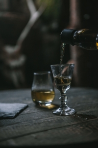 whisky being poured into a glass